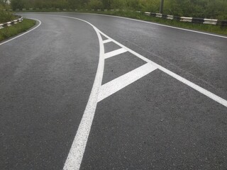 Obraz premium Road markings. White on gray and black. Abstract drawing art