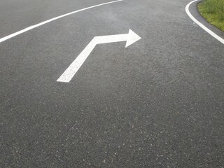 Road markings. White on gray and black. Abstract drawing art
