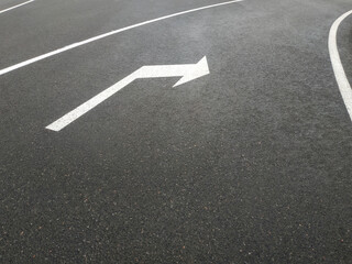 Road markings. White on gray and black. Abstract drawing art