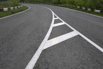 Road markings. White on gray and black. Abstract drawing art