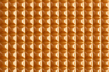 Closeup of an orange plastic texture. Abstract background for design.