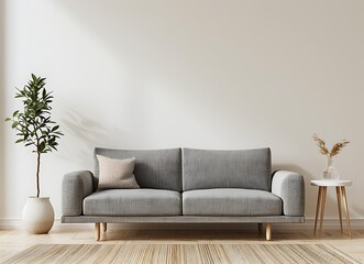 Modern living room interior with grey sofa against empty wall mockup, white side table and plant on beige rug in the style of an empty wall mockup