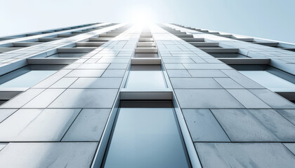 Obraz premium A modern building with vertical lines and large windows, reaching towards a bright sky
