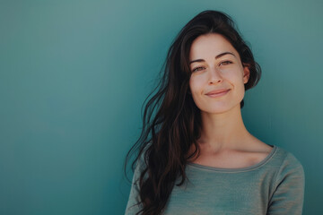 A close up portrait of a woman with a subtle smile
