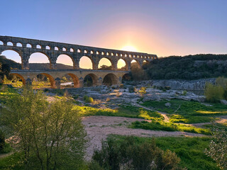 Sunset over Pont du Gare, famous roman aqueduct near Nimes, Provence, France