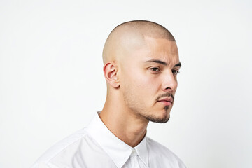 Fototapeta premium Close-up of a Man with a Shaved Head and a Goatee