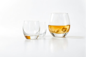 Glass of whiskey with ice cubes