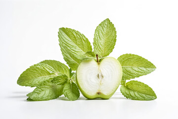 Half a green apple surrounded by fresh mint leaves