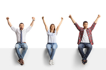 Excited men and a woman with arms up sitting on a blank panel