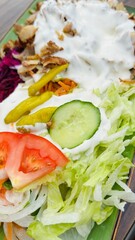 kebab plate with salad and sauce