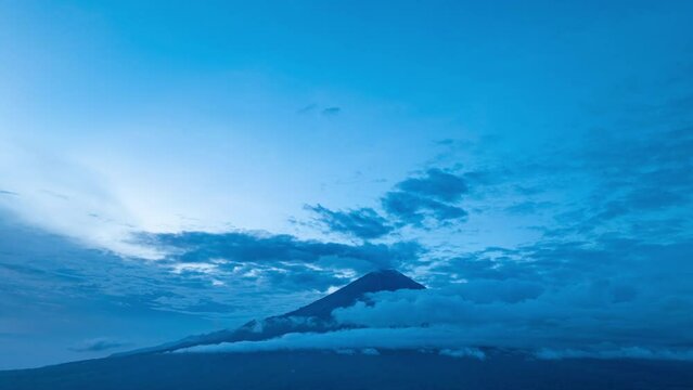 Amazing aerial hyper lapse view White clouds move in, obscuring the peaks of Simba Simeru. The beautiful and pristine natural tourist spot Simbar Semeru is a paradise for nature lovers in Indonesia.
