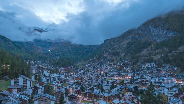 Zermatt Switzerland time lapse, city skyline day to night timelapse at Zermatt city Valley and famous Matterhorn mountain peak