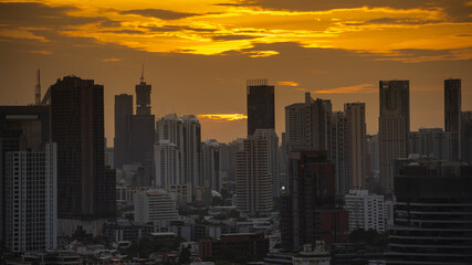 Obraz premium Aerial view of Bangkok modern office buildings, condominium in Bangkok city downtown with sunset sky , Bangkok , Thailand.