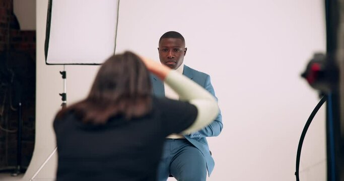 Black man, photographer and picture with fashion for production, film or content at studio. Young African, happy male person or cool model posing with producers for camera shoot in stylish clothing