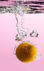 Fresh fruit falling into the water.
Organic fruits for making effective juices for dieting.