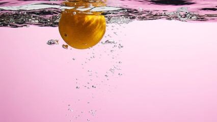 Fresh fruit falling into the water.
Organic fruits for making effective juices for dieting.