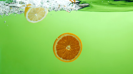 Fresh fruit falling into the water.
Organic fruits for making effective juices for dieting.