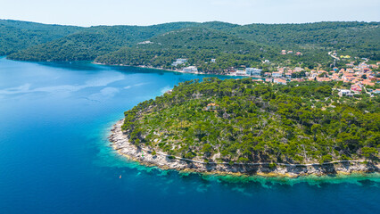Božava (Bozava) is a charming village located on Dugi Otok, Croatia, perfect for a serene summer getaway captured by drone