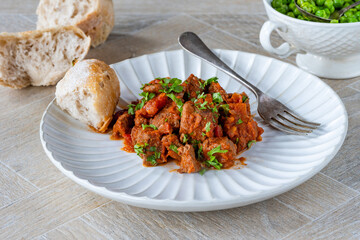 Braised beef stew in red wine and tomato sauce