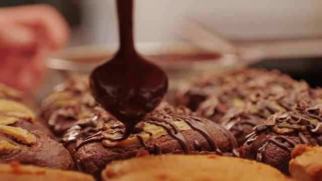 Fresh bake double chocolate banana artesian bread in bakery shop close-up. Artisan bread is making by skill bakers using natural and high-quality ingredients. Food with health and flavour