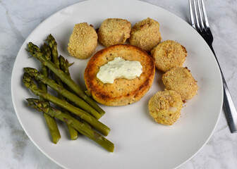 salmon burger with  scallops and asparagus