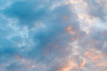 Beautiful evening sky with a mix of blue and pink clouds, creating a serene and soothing atmosphere during sunset