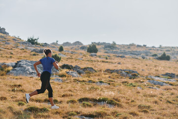 Empowered Runner Embracing Nature's Beauty on a Serene Morning Trail.