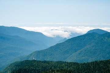 Natural background with Caucasus Mountains in clouds.
