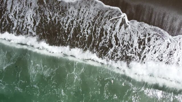 Waves crashing on the shore.