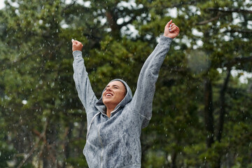 Beautiful Woman Enjoying Rainy Day After Intense Run