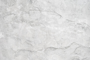 Empty cracked grey stone wall on cave for abstract background and texture. beautiful patterns, space for work, banner, seamless wallpaper close up.