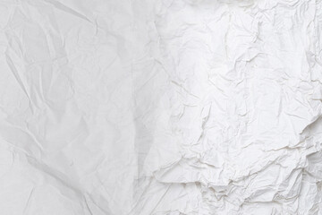 Crumpled white paper background.