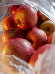 Organic apple inside bag from supermarket