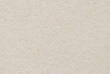 A sheet of beige recycled cardboard texture as background