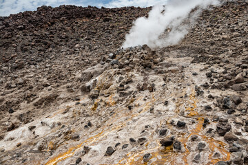 Alolabad geothermal area in Ethiopia with surreal landscape of colorful hot springs, steaming fumaroles, and erupting salt geysers in an arid, remote desert setting below sea level, Afar desert