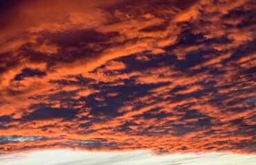 dramatic Red clouds for pattern background. A burning sky in a horror movie. crimson storm in apocalyptic, judgment day.
