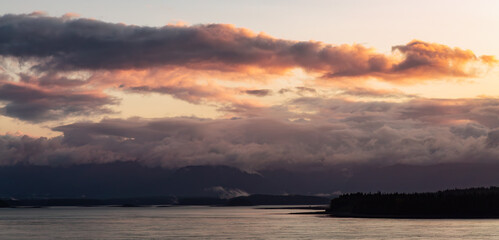 Dramatic Sunrise over Alaska Coast. Nature Background