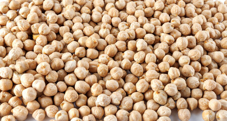 Chickpea background. The chickpeas are poured in an even layer.
