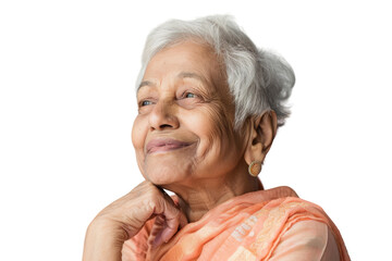 Elderly Indian woman looking up, thinking, and feeling hopeful with an idea.