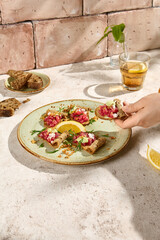 Authentic Tuna Tartare on Crispy Toasts in Sunlit Still Life Setting