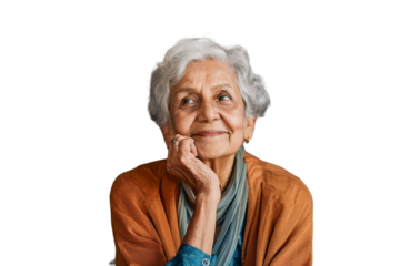 Thoughtful elderly Indian woman looking up with hope and a smile.