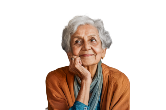 Thoughtful elderly Indian woman looking up with hope and a smile. - Powered by Adobe