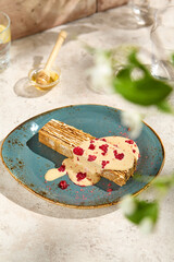 Authentic Honey Cake Medovik with Sauce in Sunlit, Aesthetic Still Life on Beige Table