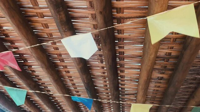 Bunting flags with paper lanterns on wooden background. Festive Brazilian or Latin American, bandeirolas festa junina 
