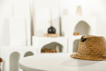 White table of free space and summer hat. Empty space for your decoration. 