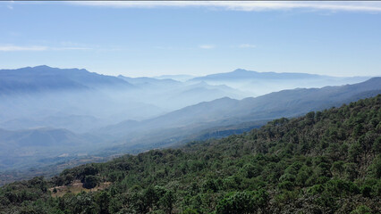 Shots in Nayarit above the mountain range in Mexico, is early in the mornig and the mis covered the mountains, in front we can see the forest © Alejandro