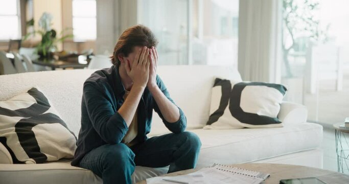Home, man and college student stress with document on sofa with exam, anxiety and worry with learning. Thinking, reading and paperwork for debt, education and school test with studying in living room