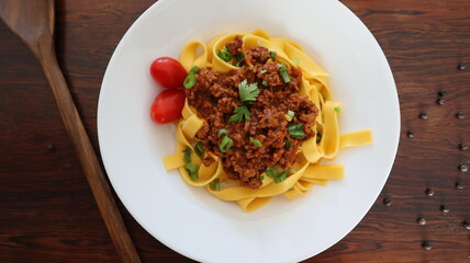Tagliatelle Pasta with Bolognese Sauce, Tomato, and Parsley