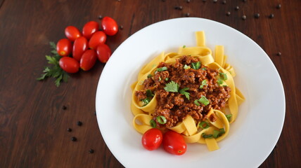 Tagliatelle Pasta with Bolognese Sauce, Tomato, and Parsley