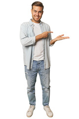 Full body portrait of a man in studio excited holding a copy space on palm.